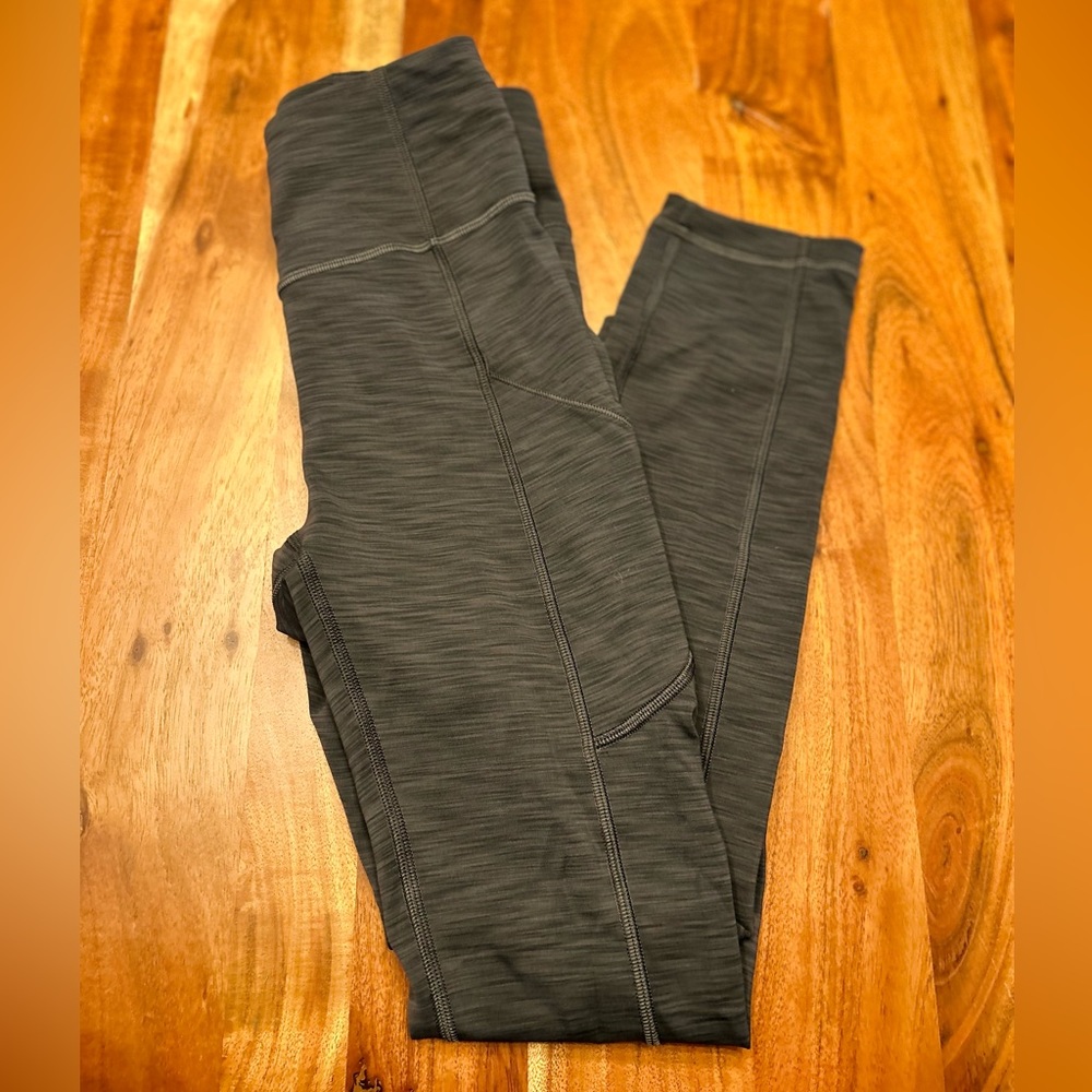 Lululemon grey heathered leggings with pockets.